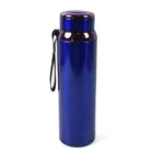 Stainless steel water bottle on table with drink inside