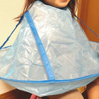 Reusable hair cutting cape with hair-catch guard for mess-free haircuts