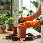 Kitchen cleaning with waterproof orange rubber gloves