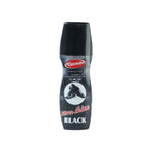 Close-up of liquid black shoe polish being applied to a shoe