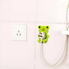Adhesive socket holder with plugs hung detail