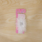 Elegant baby hair accessory featuring floral bow and elastic fabric