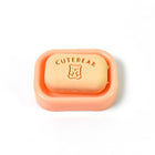 Assorted soap-shaped erasers packaged in a compact case