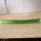 Side angle view of the flexible kitchen sink splash guard on a wooden counter.