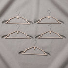 Sturdy plastic clothes hangers for daily wardrobe use