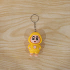 In-use image of face-changing doll keychain attached to backpack