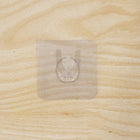 Wall hook on wooden door with transparent adhesive