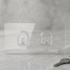 Close-up of adhesive backing on transparent wall hook