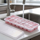 Easy release ice cube tray with lid in freezer