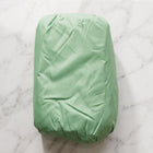 Unfolded inflatable air sofa on grass for outdoor lounging