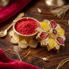 Close-up of ornate golden pooja kumkum box