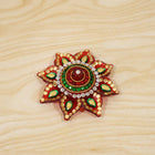 Live setup of the kumkum dani during a pooja ceremony.