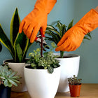 Close-up of durable orange cleaning rubber gloves