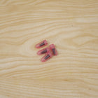 Pink tubeless tire repair nail in use