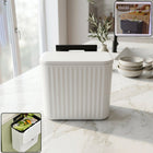 Front view of portable plastic dustbin with lid
