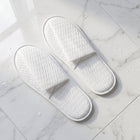 White disposable slippers with cushioned soles