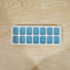 Blue ice cube tray in use for making ice cubes