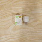 USB LED night light shining warm glow in a dark room